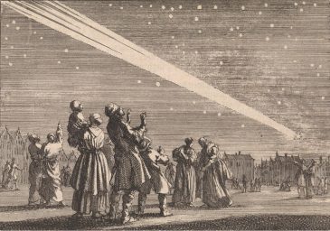 Una multitud de personas observa un cometa